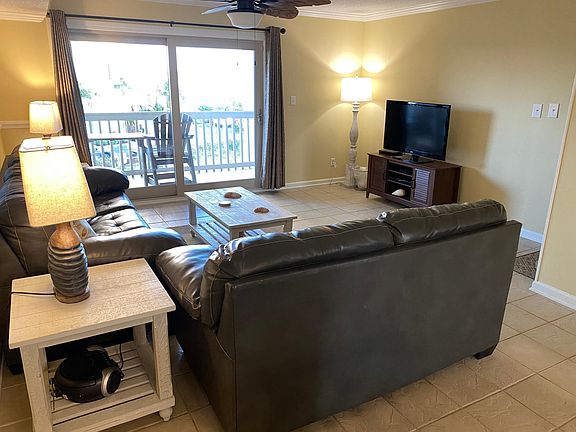 Living room with private balcony access