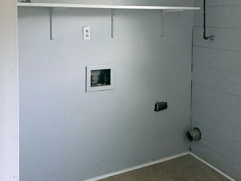 Washer/dryer hookups and shelving.