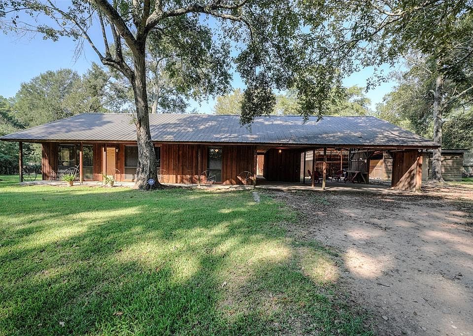 Set back from the street with beautiful trees surounding it, this home is perfectly situated on almost half an acre.