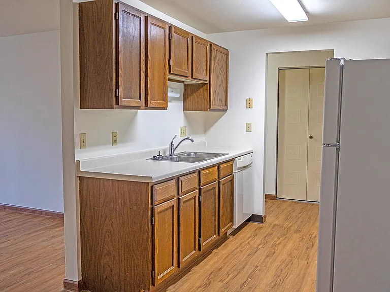 Elevate your culinary experiences in the fully equipped kitchen at The Gallery. Featuring spacious cabinets, modern appliances, and a warm ambiance, this kitchen is perfect for all your meal preparations. Schedule a tour today to see it in person!