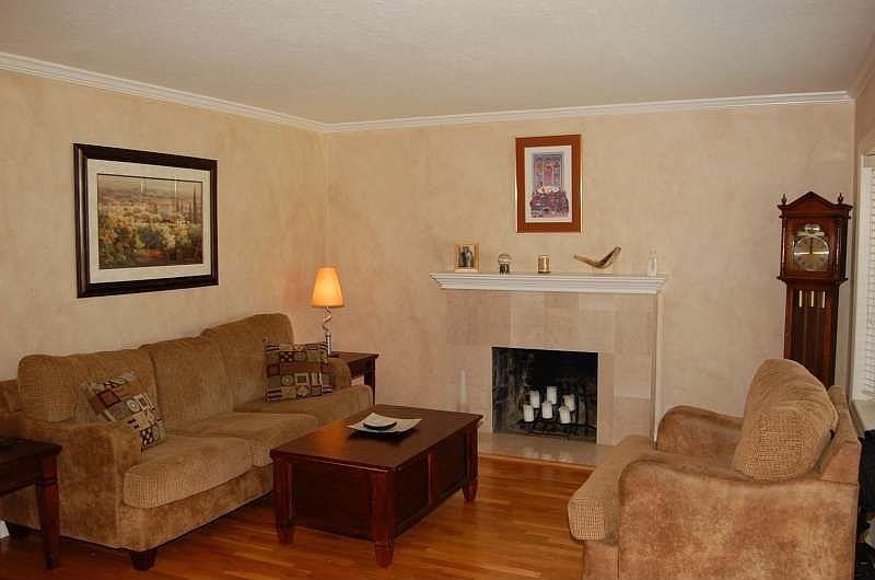 Living Room Features Marble Fireplace, Crown Molding, Bay Window