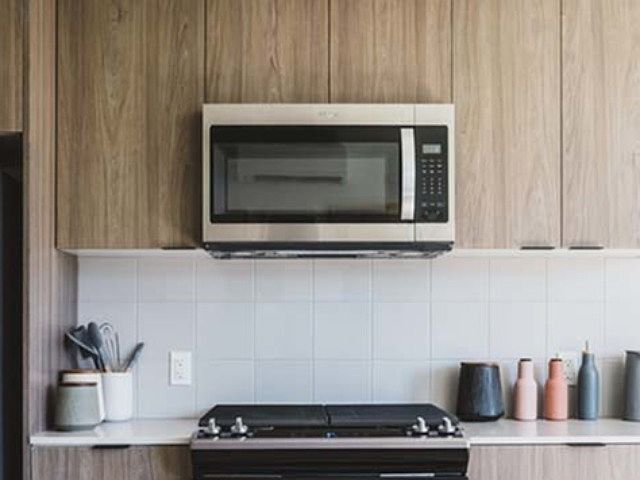 Close up of stainless steel appliances in kitchen