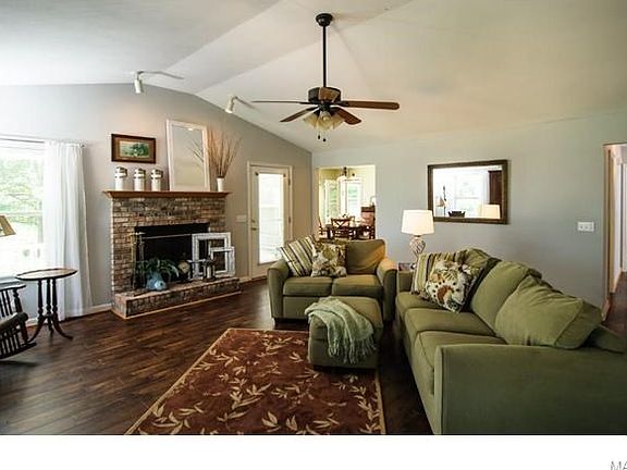 Open floor plan, vaulted ceilings, cozy fireplace -