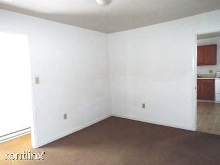 living area toward hallway and kitchen