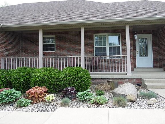 Wonderful landscaping, covered porch, recessed lighting.