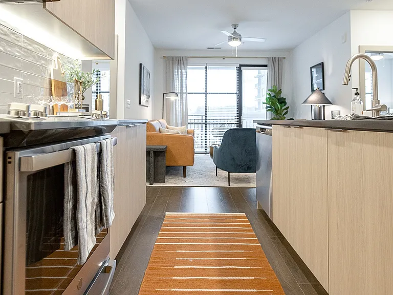 Open kitchen leading to cozy living space.