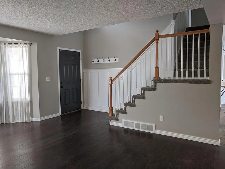 Main entrance door and stairs to 2nd level