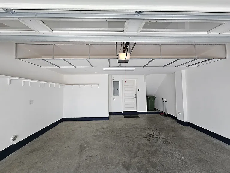 Large 2 car garage, very spacious, also have installed additional shelves on the side and on top for storage