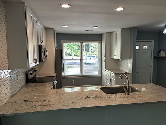 Kitchen with coffee bar on the right