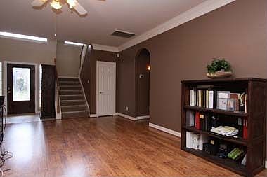 The  spacious den with a view of the entry.