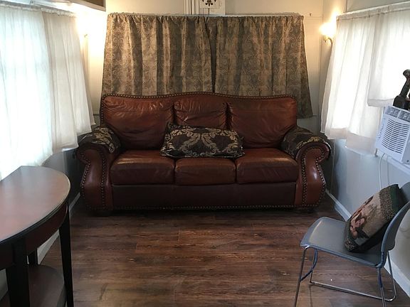 Living area with coat closet, next room for room with washer connection.