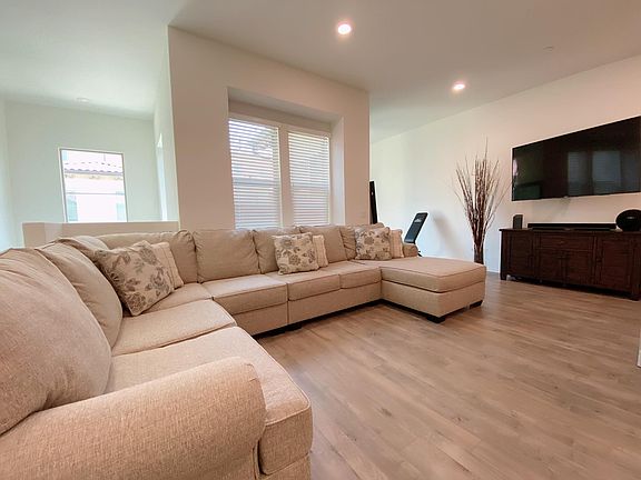 Spacious living room. Bonus room has been set up as a gym but can be set up as an office or a playroom!