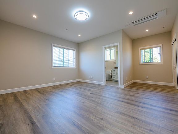 A4 suite including full bath, small office area next to the window, and closet
