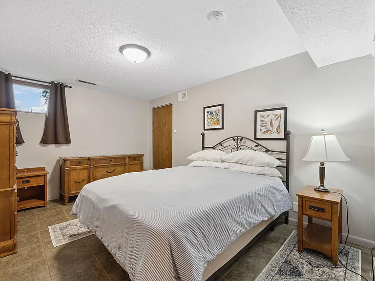 Bedroom is large and spacious with one queen bed.