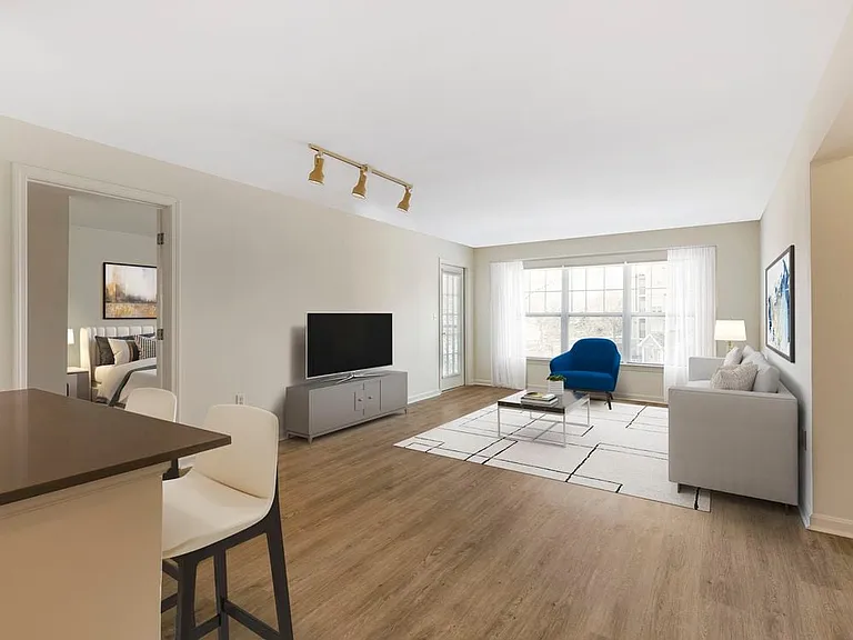 Phase I Renovated Package I apartment dining and living room with hard surface flooring
