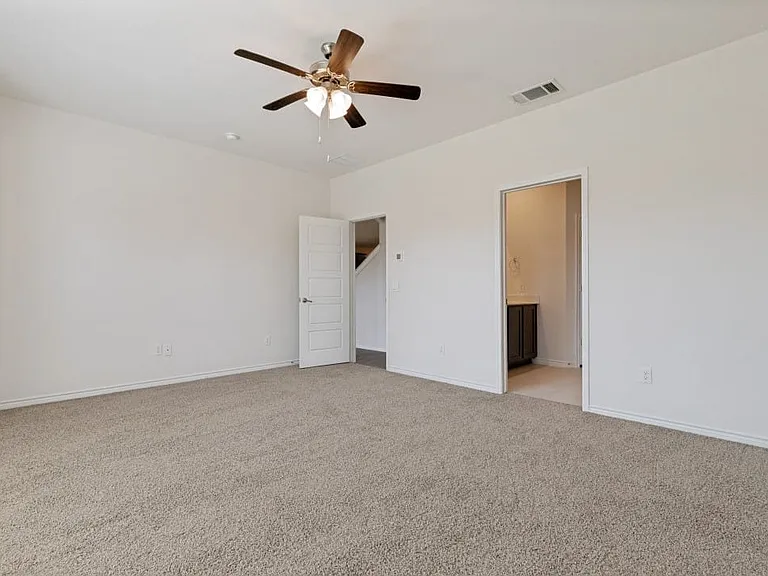 Neutral-toned carpeting throughout