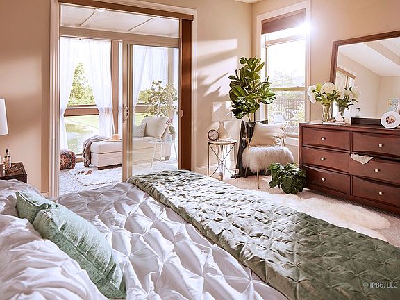 Verona bonus model showing the view from the owner s suite to the screened-in porch and the courtyar