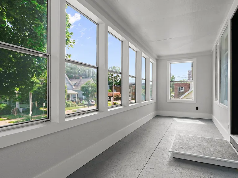 SPACIOUS FRONT PORCH! Buffer for the outside to the inside. Plenty of light. Cute neighborhood!