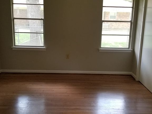 Bedroom with wood floors