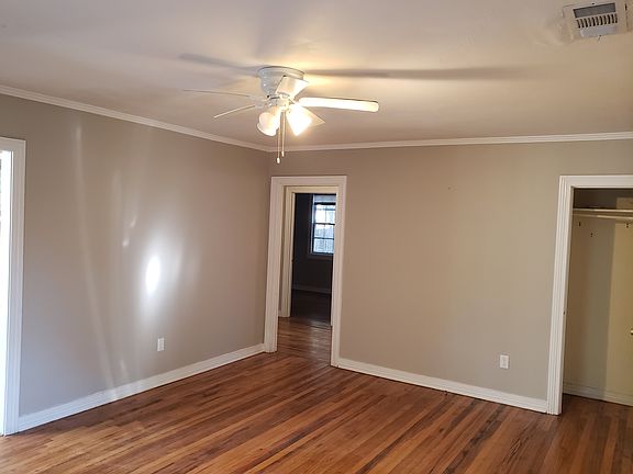 Living room from other side - hall is in middle, right door is a closet.