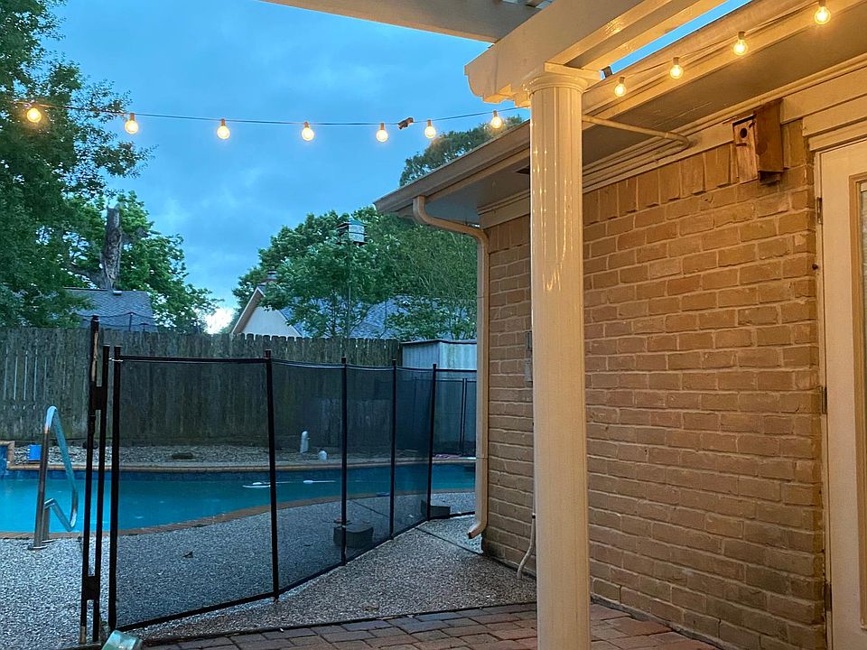 Covered patio overlooking pool