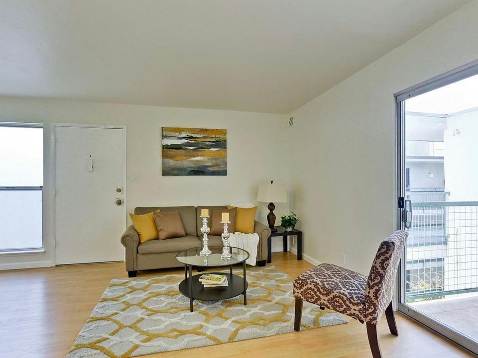 Spacious living room with access to deck