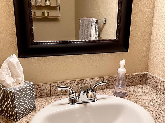 Downstairs powder room, just off the living room, under the stairs