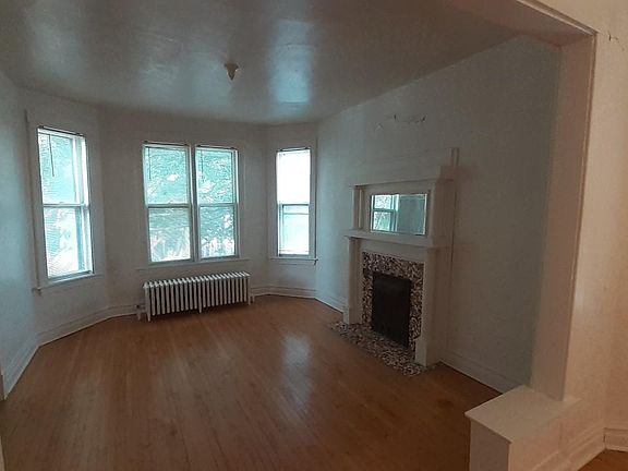 Livingroom (looks out to front of house). Non- functioning fireplace.