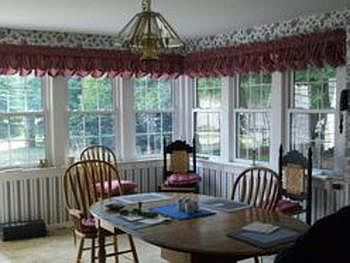What a bright dining room - look at all the windows
