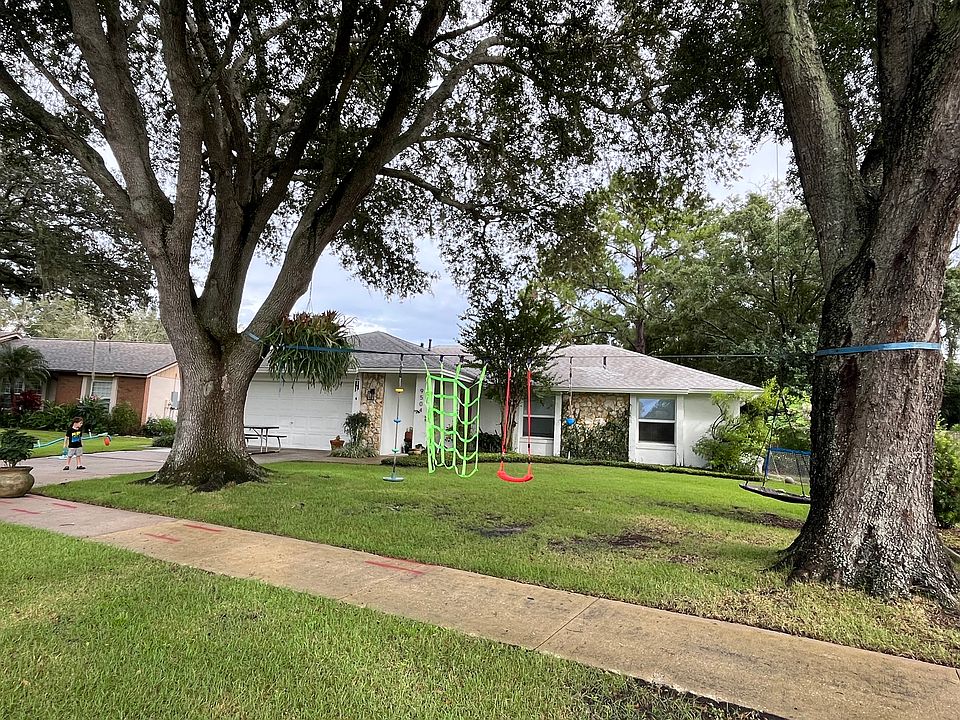 shaded front yard allows year long play. (yard care included in rent - no worries about the leaves!)