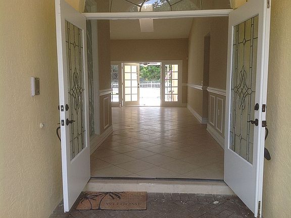 Front entrance looks to pool