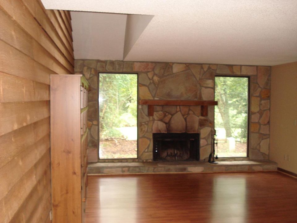 Living room facing back overlooking a small meadow