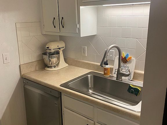 New dishwasher, sink, and kitchen faucet.
