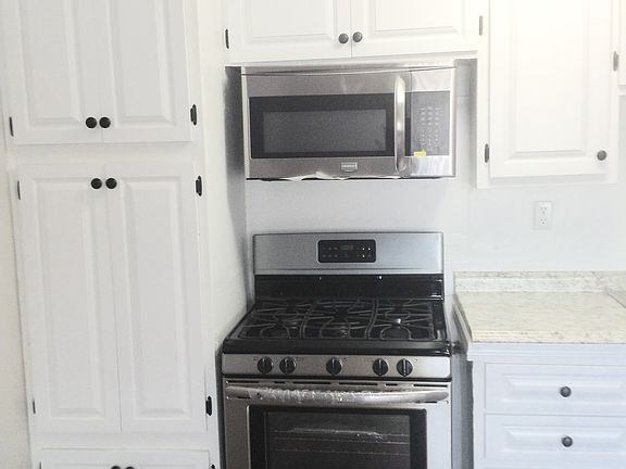 Top of the line 5-burner stainless steel stove & matching microwave