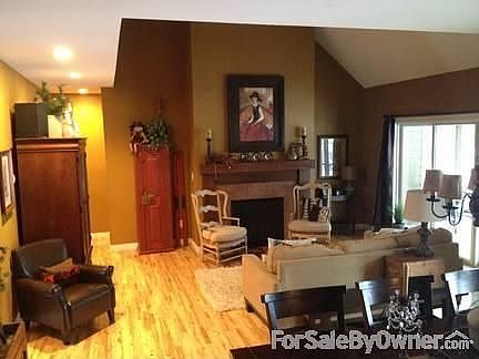 Vaulted family room
						:
						Gas fireplace, Balcony above, Opens up to screened in porch