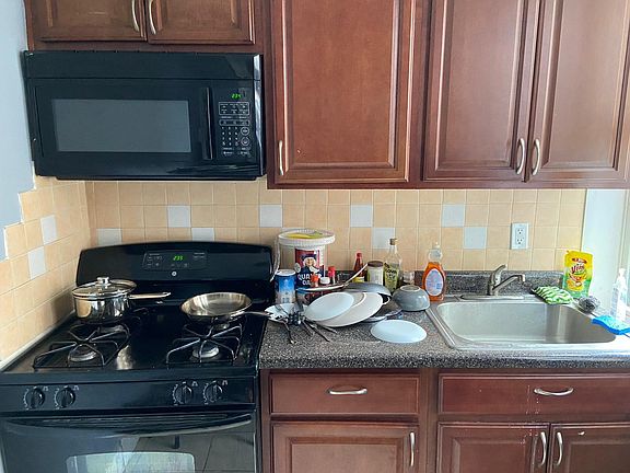 kitchen, microwave, stove, oven, drawers, cabinets.