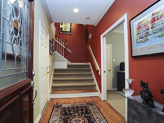 Entry: foyer leading to downstairs 3rd bedroom with full bath