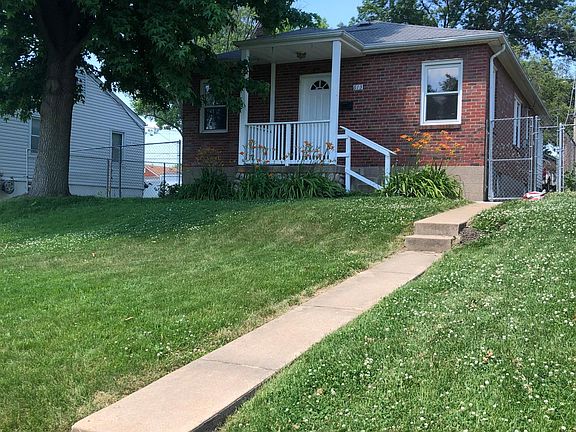 Front of house with a balcony for sitting.