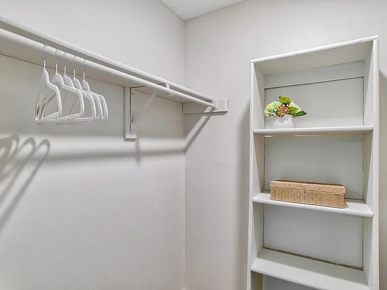 A walk-in closet with ample storage