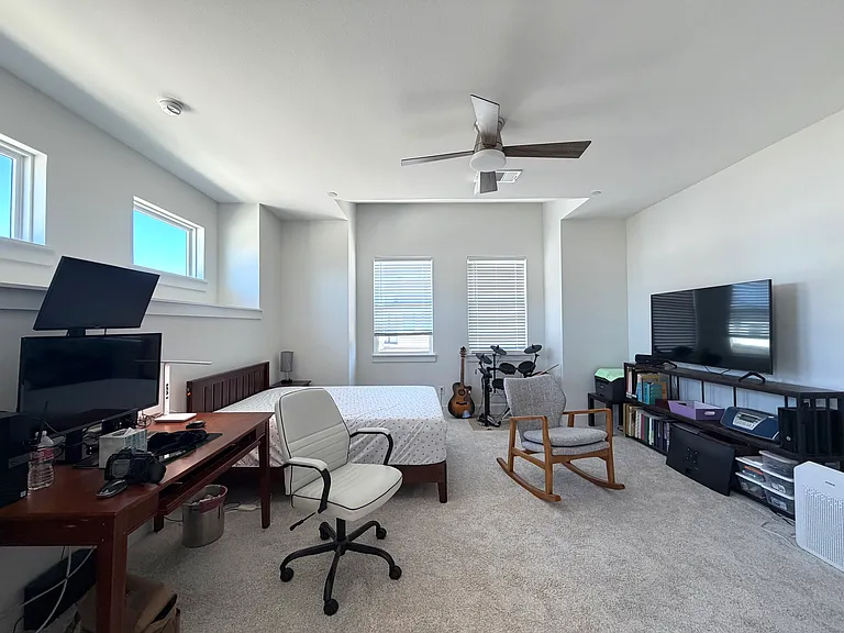 The primary suite is generously sized with enough space for a home office.