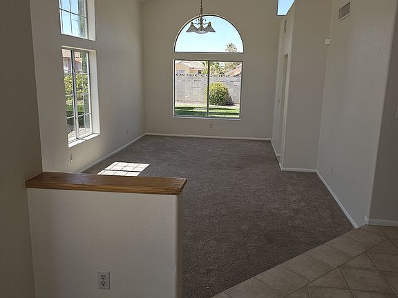 Voluminous ceilings and an array of windows create an airy living space