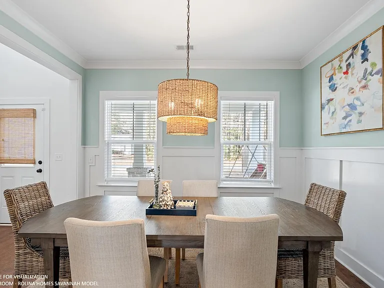 DINING ROOM PICTURE FROM A DIFFERENT SAVANNAH MODEL RECENTLY BUILT BY ROLINA HOMES