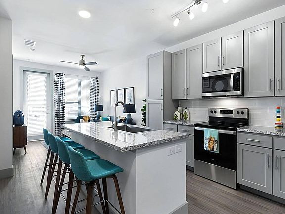 Modern Kitchen with Stainless Steel Appliances and Granite Countertops