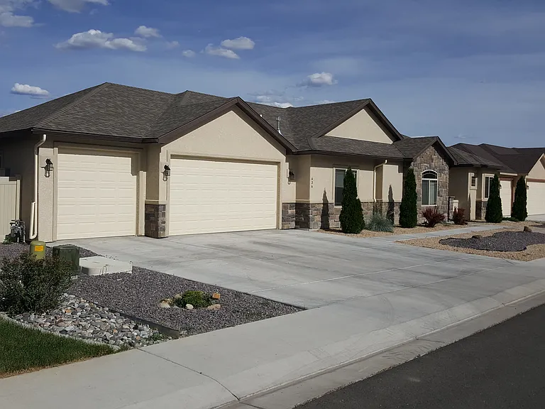 Front showing 3 car garage