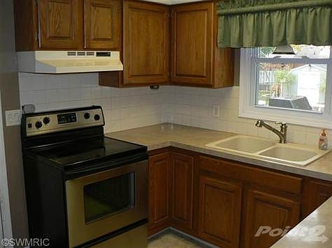 Custom spray faucet extra deep sink and garbage disposal.