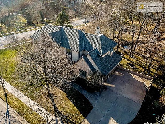 Fairway views with creek and bridge.
