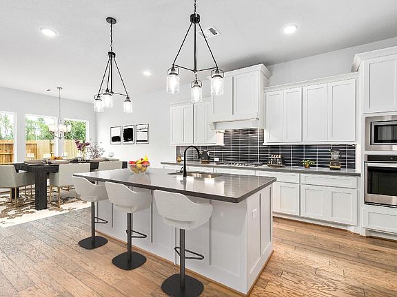 Stainless appliances in kitchen, virtually staged for demonstration