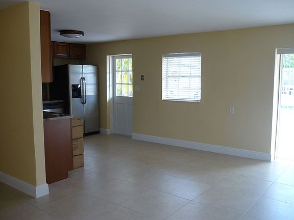 door in kitchen leads to pool area