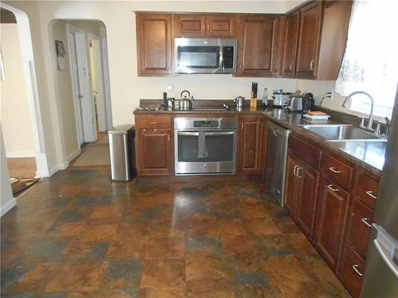 Kitchen: The kitchen is efficiently designed with ample storage and counter space.  It includes everything a cook could want. Al