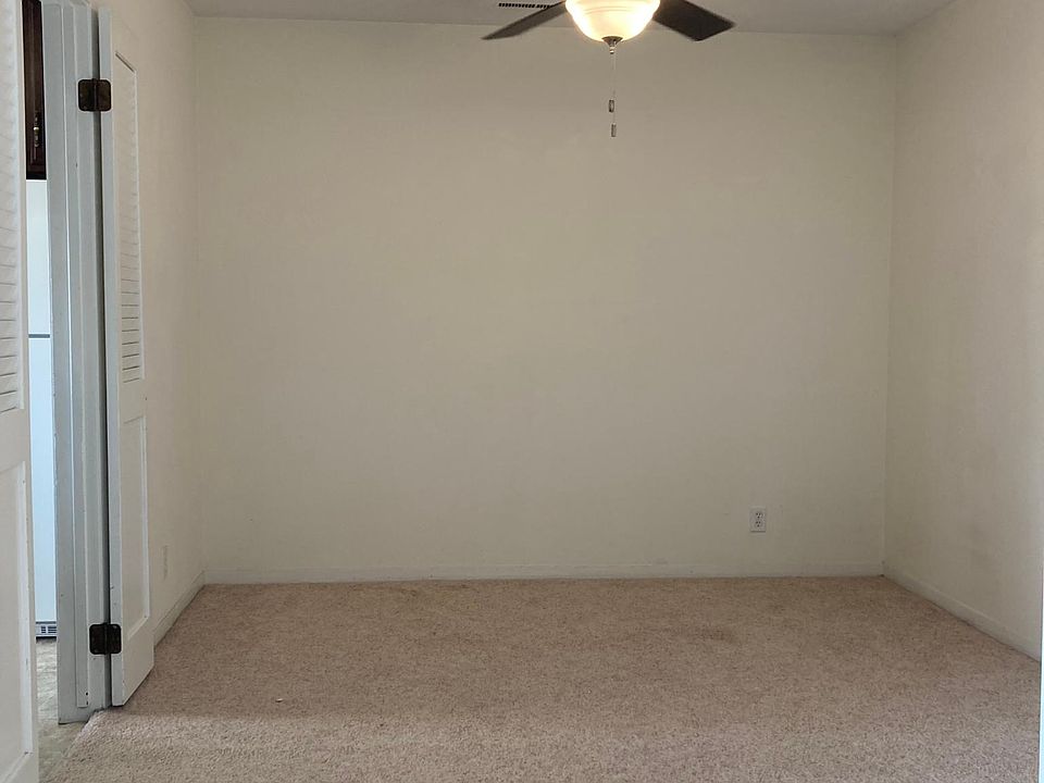 Formal dining room with new ceiling fan.